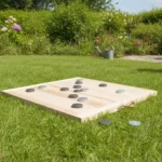 Comment jouer au palet breton : règles, distance et matériel 3 Jeu de palet breton dans un jardin